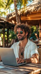 Digital Nomad Working on Laptop at Tropical Beach Bar