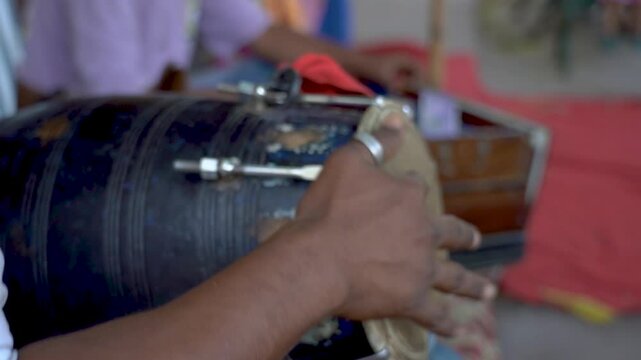 Rajasthani Folk Music is an integral part of the state&rsquo;s cultural identity. A close shot of a person playing the drum or dholak. Dholak and Hands.