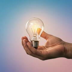 Hand holding glowing lightbulb symbolizing bright idea and creativity with soft gradient background in warm and cool tones