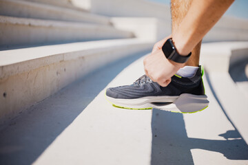 Inspired athlete reaching new heights during outdoor workout on sunlit stairs in the afternoon,...