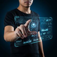 Man interacting with digital hologram interface showing futuristic data charts and graphs, technology concept with glowing blue elements and touch control