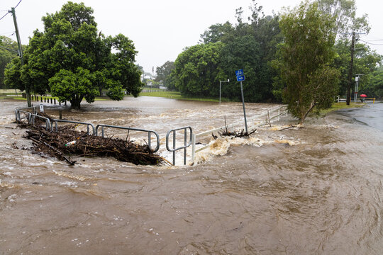 Floodwaters cover a bridge over the Ithaca Creek in the suburb of Red Hill in Brisbane