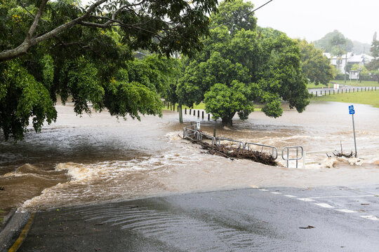 Floodwaters cover a bridge over the Ithaca Creek in the suburb of Red Hill in Brisbane