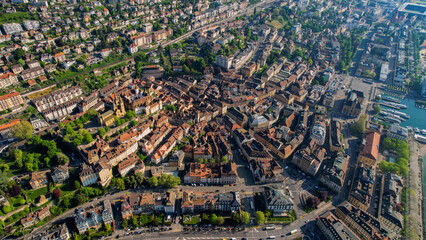 A panoramic aerial view around the old town of the city Neuchâtel in Switzerland on a sunny spring...