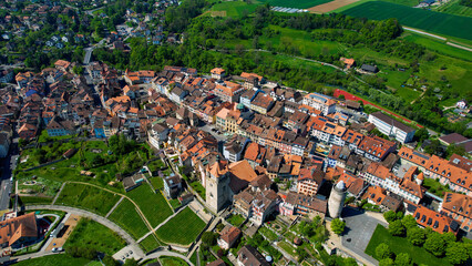 A panoramic aerial view around the old town of the city Orbe in Switzerland on a sunny spring noon