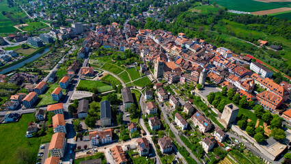 A panoramic aerial view around the old town of the city Orbe in Switzerland on a sunny spring noon