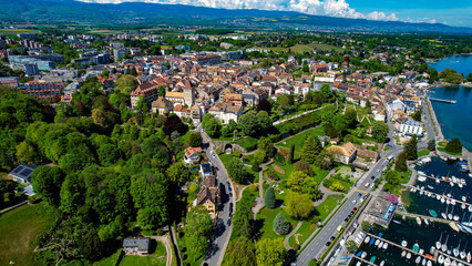 A panoramic aerial view around the old town of the city Coppet in Switzerland on a sunny spring noon