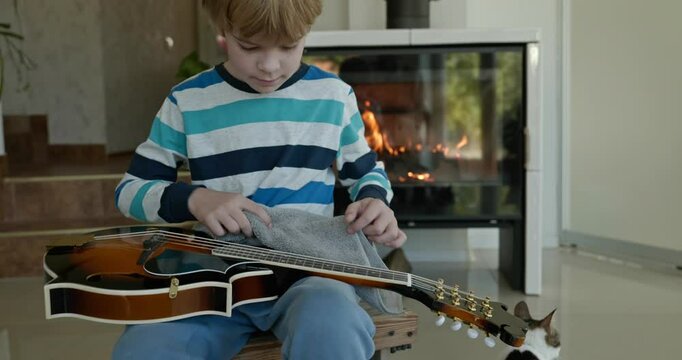 Caucasian Kid Play Mandolin at Home. European Boy Practice Music 4K 10-bit