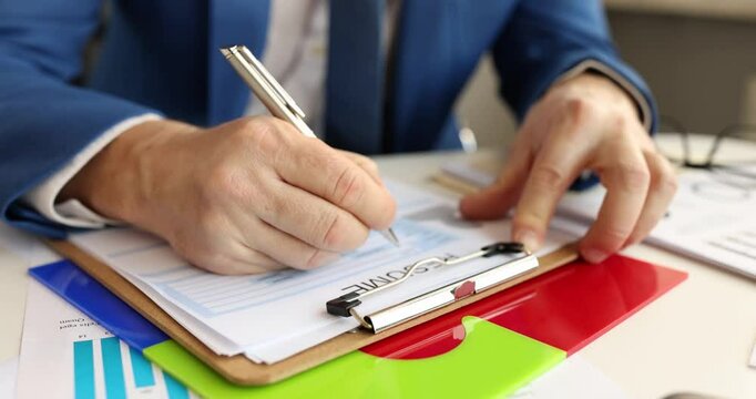 Man completes job application filling employment form signing career document at table. Workplace opportunity networking for professional advancement