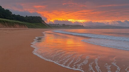 Spectacular Orange Sunset Reflection on Beach with Waves and Cloudy Sky