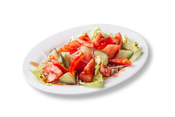 Isolated vegetable salad made of chopped tomatoes, cucumbers, bell peppers, red onions and lettuce, served with balsamic dressing. Healthy raw dish perfect for dietary, vegan or clean eating food