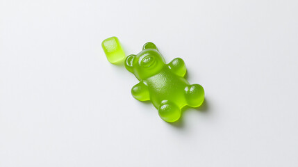 Vibrant Top-Down View of a Playful Neon Green Gummy Bear Perfect for Sweet Treat Lovers and Candy Enthusiasts Seeking Fun and Colorful Snack Inspiration