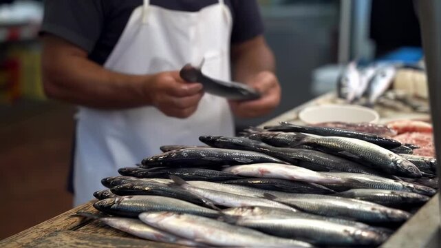 Fishmonger prepares fresh catch at bustling market stall with care