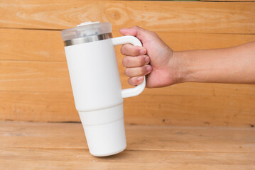 White HANDLE TUMBLER on wood table