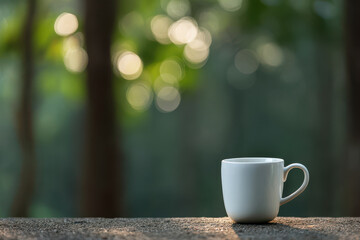 minimalistic coffee cup placed on clean surface surrounded by serene evening forest