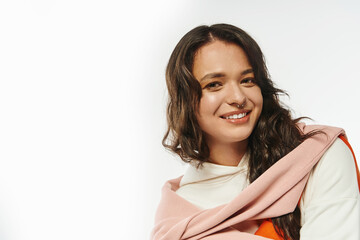 Stylish young woman radiates confidence in trendy attire during a fashionable studio shoot