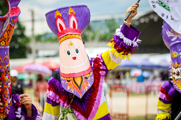 Phi Ta Khon is the name of performance in which performers wear scary and ugly but colorful masks,...