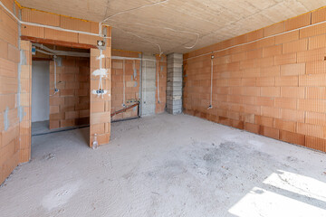  Interior of Unfinished Apartment with Brick Walls and Concrete Ceiling – Under Construction Residential Building, Real Estate Development, Industrial Architecture Background