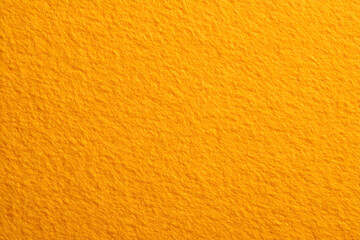 Naklejka premium Bright golden yellow textile felt material with seamless texture perfect for packaging, children’s content, and visuals