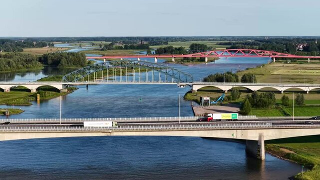 Zwolle, 12th of July 2025 Freighter on the IJssel River with the A28 near Zwolle with the IJssel Bridge, Katerveer II Bridge, and the Hanzeboog Bridge