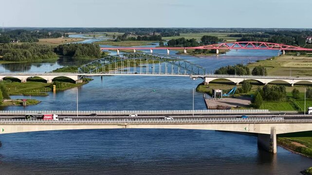 Zwolle, 12th of July 2025 Freighter on the IJssel River with the A28 near Zwolle with the IJssel Bridge, Katerveer II Bridge, and the Hanzeboog Bridge