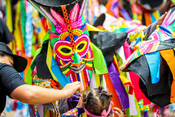 Phi Ta Khon is the name of performance in which performers wear scary and ugly but colorful masks,...