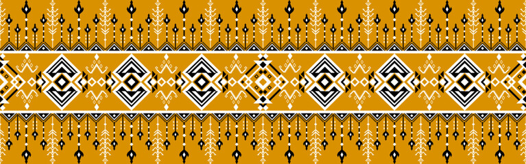 Traditional textile pattern featuring geometric shapes and symmetrical designs in mustard yellow, white, and black tones.