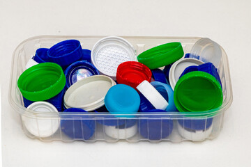 Pile of colorful plastic bottle caps ready for recycling