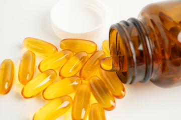 Fish oil or Cod liver oil gel in capsules with omega 3 vitamins, supplementary healthy food.