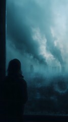Person silhouetted against a polluted urban skyline
