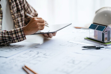 Interior architecture or engineer working on blueprint and planning projects