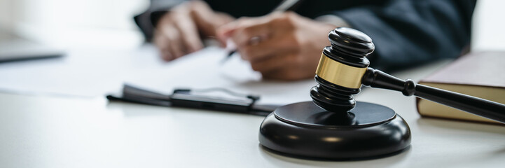 lawyer or judge counselor reading a important legal contract documents in office