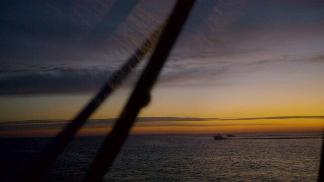 Dawn over sea seen from fishing boat near Barnegat Light