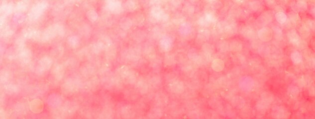 Pink glitter bokeh background with glowing defocused lights for Valentine's Day or Christmas design backdrop