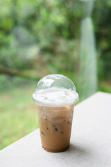 Coffee in a plastic cup to take home