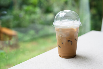 Coffee in a plastic cup to take home