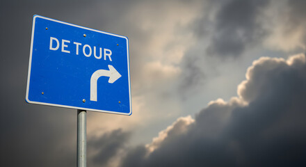 Fototapeta premium Blue Detour Sign Against Dramatic Cloudy Sky Suggesting Alternative Route