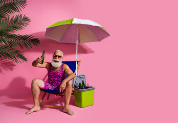 Photo of cheerful man wear swimwear shorts relax rest drink cold beer resort empty space isolated...
