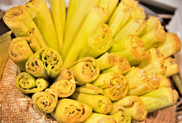 Corn husks inside a straw hat prepared to make Pamonha. Sweet eaten at June and São João parties...