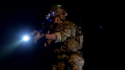 special forces soldiers conduct a night raid using night vision goggles a tactical light and a laser sight A concept for modern warfare and covert operations