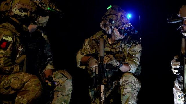 special forces soldiers conduct a night raid using night vision goggles a tactical light and a laser sight A concept for modern warfare and covert operations