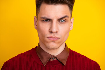 Young Handsome Man in Trendy Outfit with Expressive Look on Yellow Background