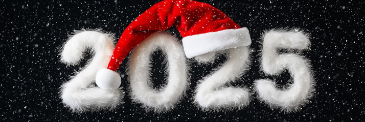 Santa hat placed on white fluffy 2025 3D numerals against deep black background showcasing a festive winter season theme