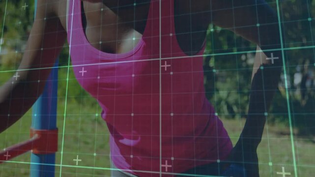 Woman approaching blue parallel bars gripping dumbbell and dipping torso as grid tracking fitness