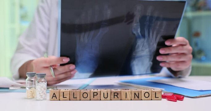 A medical professional examines an Xray while referencing details about Allopurinol for treatment decisions