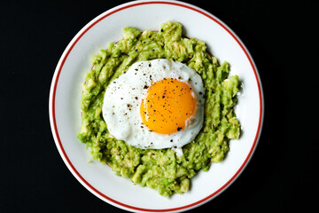 Healthy Fried Egg On Mashed Avocado Meal