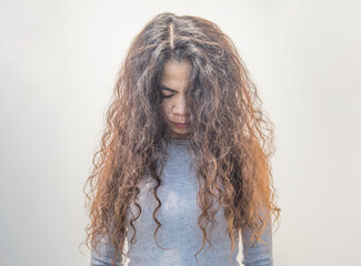 Image of a woman with long curly hair