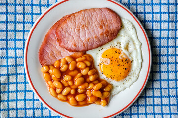 Fried Egg With Pork Bacon Rashers And Baked Beans In Tomato Sauce