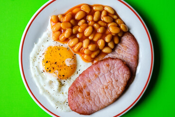 Fried Egg With Pork Bacon Rashers And Baked Beans In Tomato Sauce