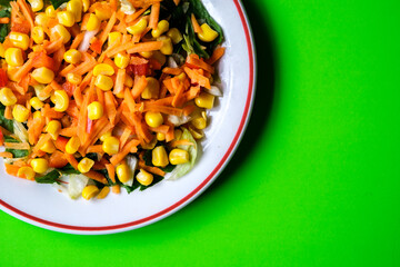 Fresh Refreshiung Summer Salad Of Sweet Corn Carrots Red Peppers and Leaves